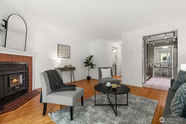 Beautiful hardwood laminate floors add warmth and elegance throughout the home.
