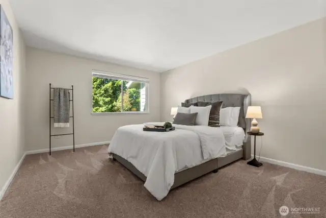 The spacious primary bedroom offers a relaxing retreat with plenty of room for all your furnishings.