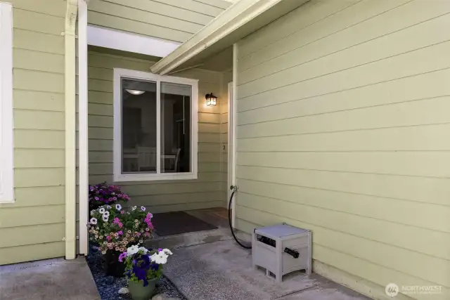 Stroll up to your charming front porch, the perfect spot to enjoy your morning coffee or greet neighbors passing by.