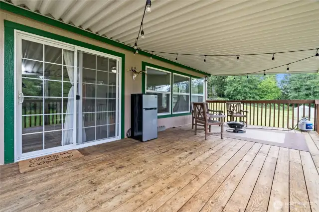 Huge COVERED deck with slider off the family room.