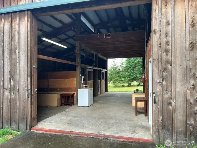 Beautiful Cedar barn opens on both ends for a handy breezeway.