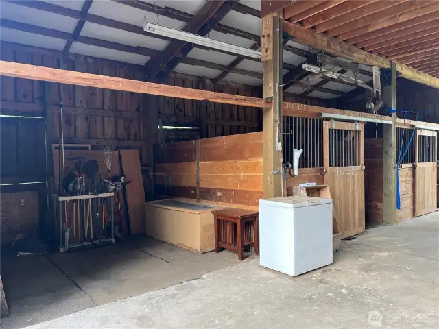 Space for a 3rd stall, wash rack, or grooming & tacking area.
