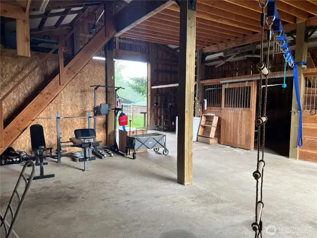 More space for additional stalls, equipment storage or what have you! Stairs to hay loft.