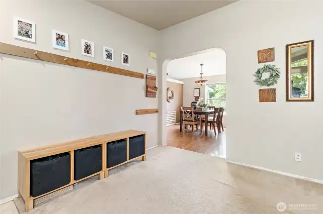 View of entryway looking on into the kitchen and eating space.