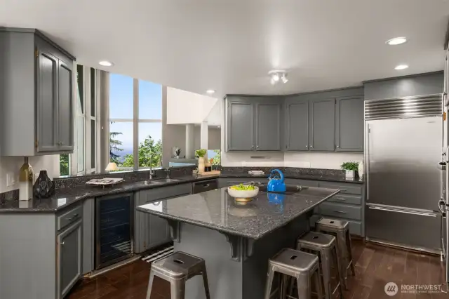 Enjoy your chef's kitchen fitted with stone counters, ample storage, & a brand-new wall mounted oven & microwave.