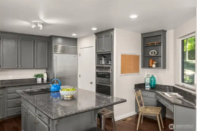 The kitchen also features a desk space and walk-in pantry.