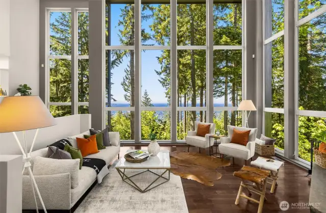 This home was designed to maximize allowance for natural sunlight.  These 2-story windows are a brilliantly showcase the incredible vistas.