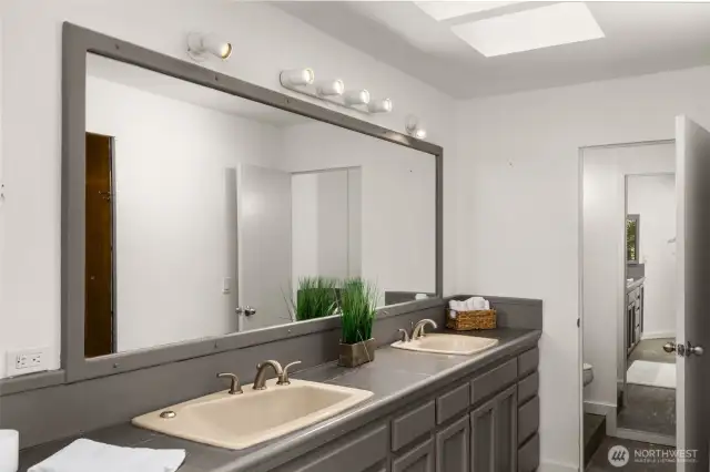 The en-suite bathroom offers a double sink & large walk-in closet.
