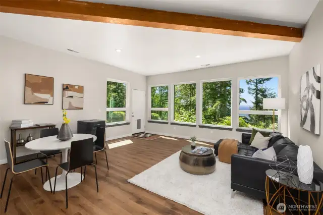 Descend to the lower level to find a wonderful rec room with newer luxury vinyl plank flooring.  Views are on display in this space, even though it is the lowest level!  Exterior access provides the possibility of converting this to a MIL space.