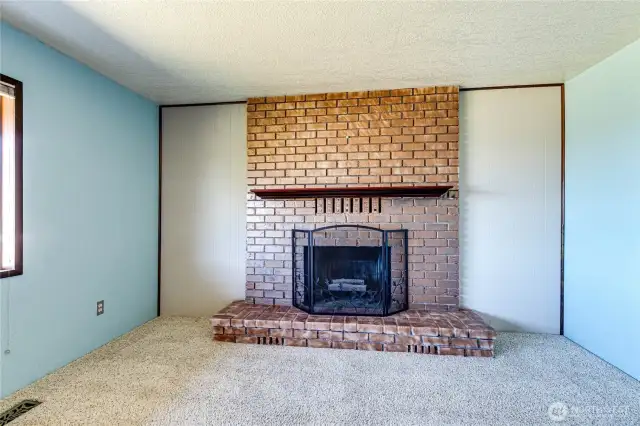 Cozy wood burning fireplace.