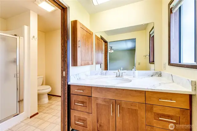 Ensuite bathroom for primary bedroom.