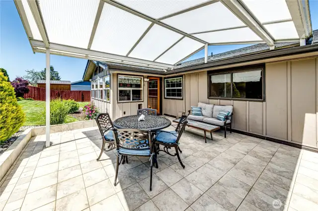 Access outdoor covered entertainment space off of the sunroom.