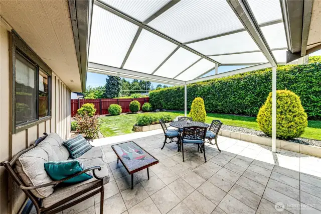 Covered patio enables you to enjoy your private backyard in any weather.