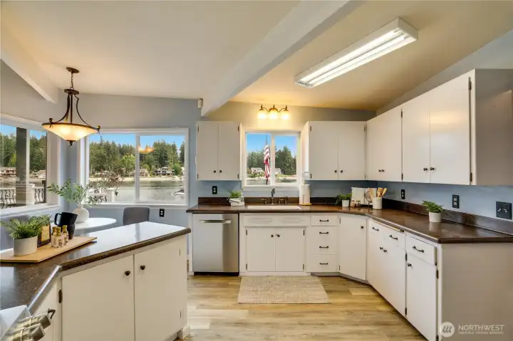Cook with a view—this well-planned kitchen features double ovens and multiple windows