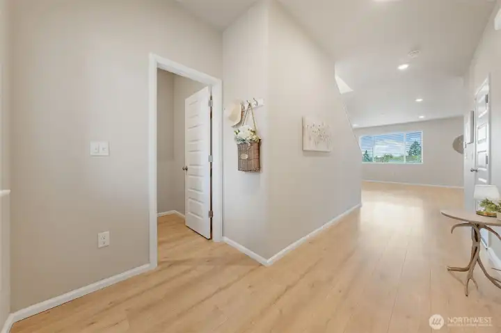 Hardwood flooring flows from the front entry throughout the entire main floor.
