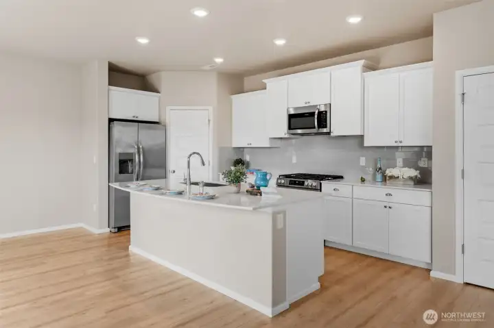 A closer look at the kitchen. The center island is large enought to seat four or five comfortably.