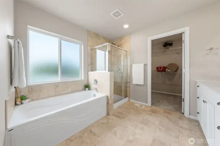 Primary bath shower and separate soaking tub.