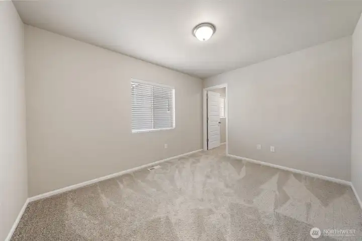 2nd bedroom upstairs with a walk-in closet.