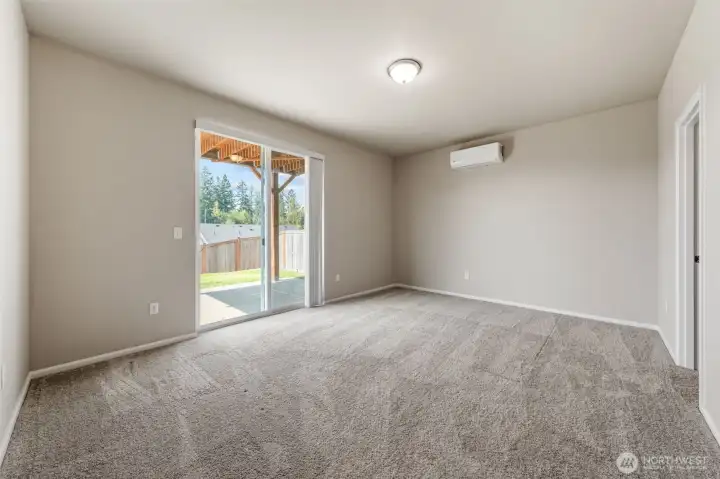 Basement bedroom suite with full bath and walk-in closet. Another sliding glass door to a covered patio.