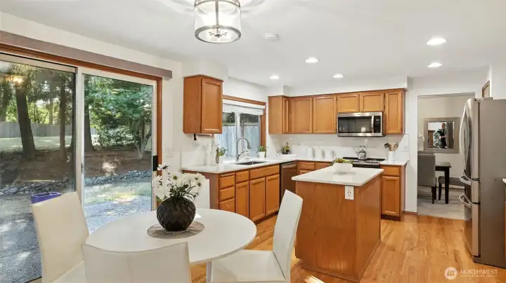 Sunny eating nook with slider to generous backyard