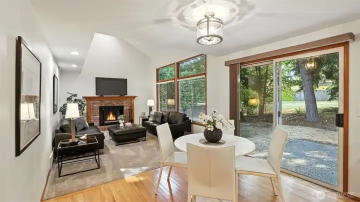 The family room features vaulted ceilings and real brick fireplace