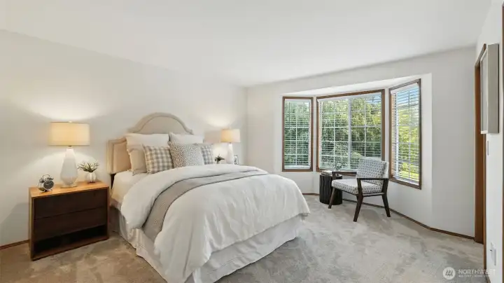 The roomy primary suite offers a bay window