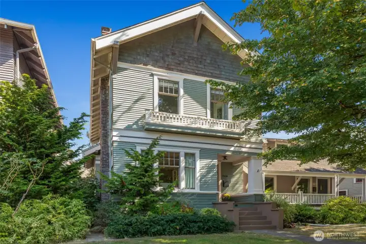 The classic lines and original exterior details - cedar shingles, siding, multi paned windows,  sweet railing under the upstairs windows, and front porch millwork have been preserved and well maintained.