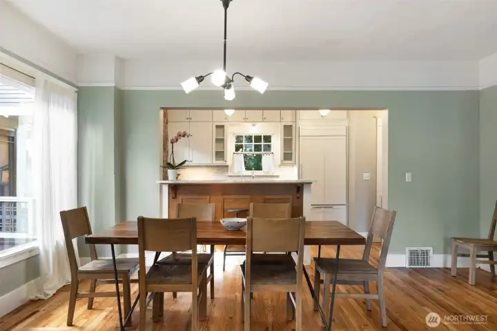 The wall to the kitchen was opened up in the kitchen remodel for nice flow between the spaces.
