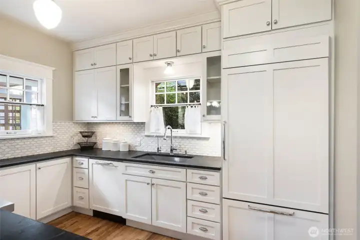 The integrated panel fridge blends with the classic white cabinetry.