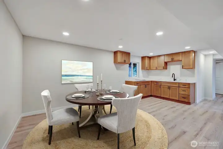 Lower level dining room area & kitchenette. A complete separate living space downstairs makes this a perfect multi-generational home! virtual staging