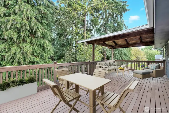 Enormous back deck with part of it covered for year round enjoyment! virtual staging