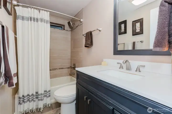 Remodeled bath with tile shower