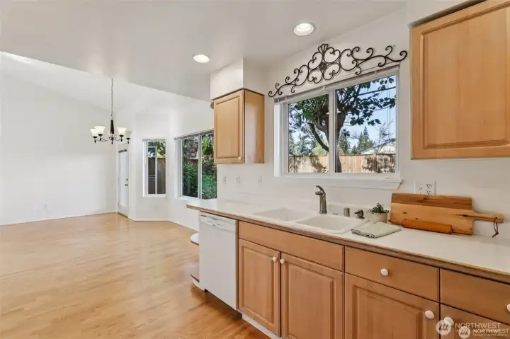 Warm maple cabinets line this open kitchen with plenty of storage and counter space!