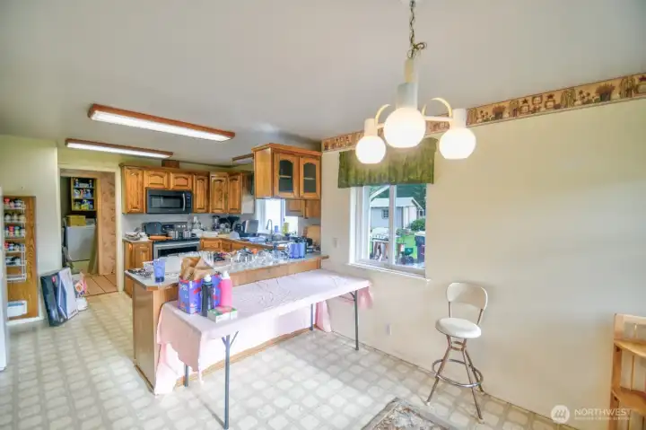 Eating space separated by island in the kitchen.