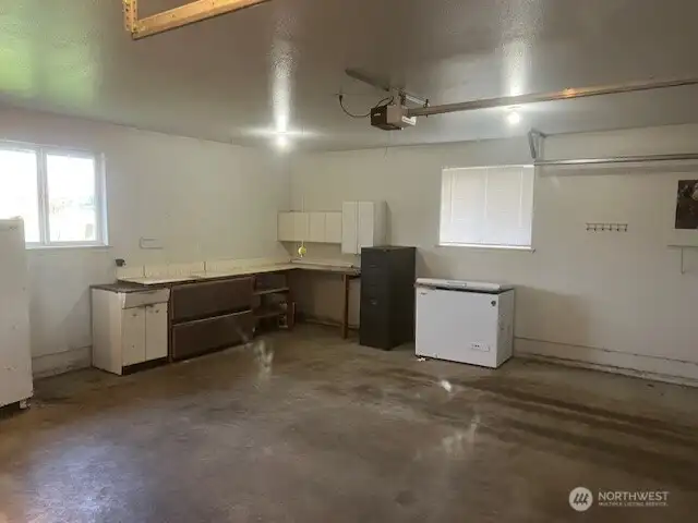 2 car garage with workspace.