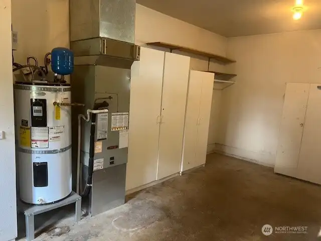 Furnace and hot water heater in garage.