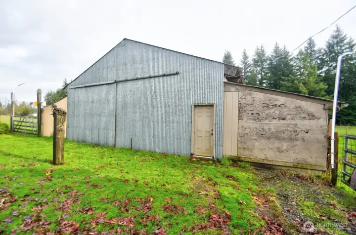 Barn has a large sliding door for easy hay delivery.