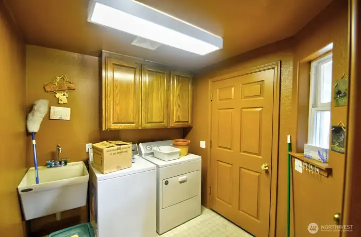Laundry with washer and dryer included.  Garage enters here for great mud room.