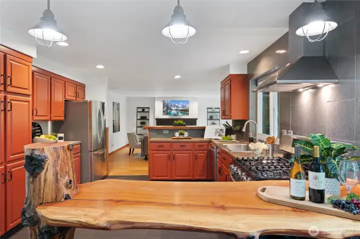 You'll love the large gas stove and french-door refrigerator with icemaker in this Chef's Kitchen. Notice the large pantry cabinets, too.