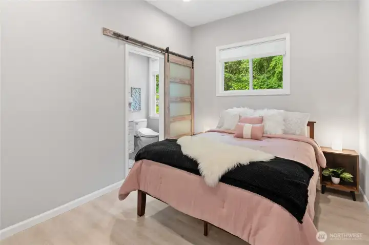 There is a bonus bedroom off of main level with its own en suite bath ~ perfect for guests!