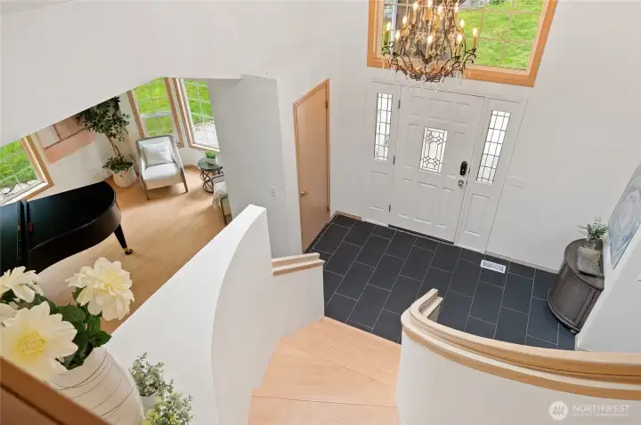 The grand staircase overlooks the entry and takes you to the second floor.