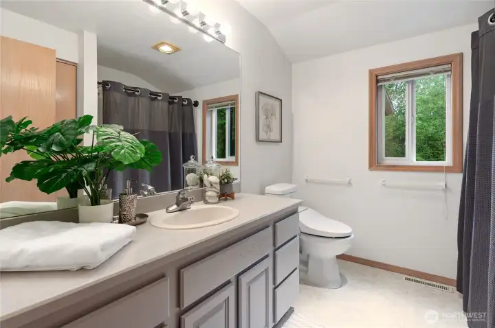 You will appreciate the large vanity in the upstairs bath ~ did we mention all toilets have a remote bidet?