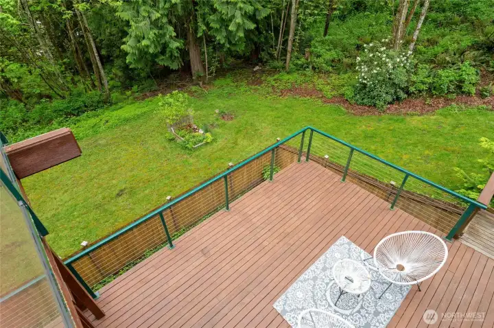 Looking down from the deck, you see how amazing this property is ~ add a fire pit or veggie beds!
