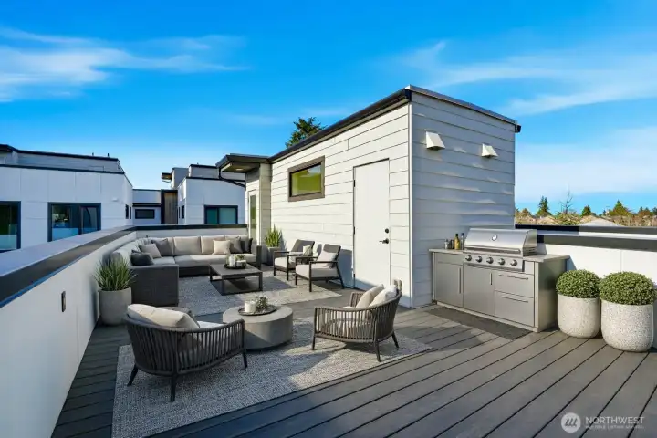 Expansive rooftop deck with virtual staging offering a large outdoor entertaining area with open views and ample space for seating.