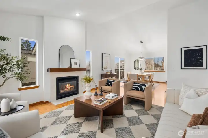 Open floor plan between living and dining w/ deck access