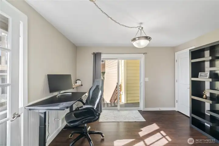 Main floor flex room could be bedroom/office/  workout room. Slider to back of home.