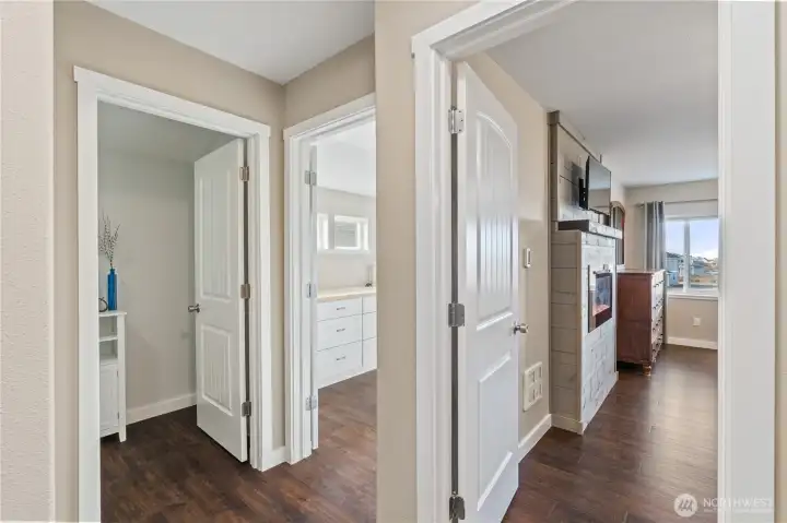 Hallway showing office space to left and primary room to right