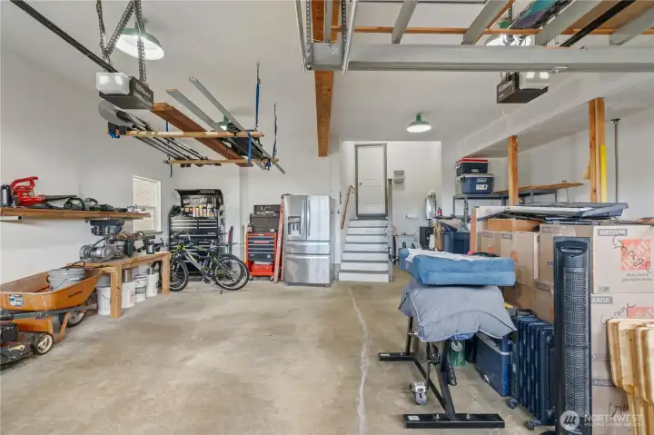 2 car oversized garage with tons of storage & built-in work bench