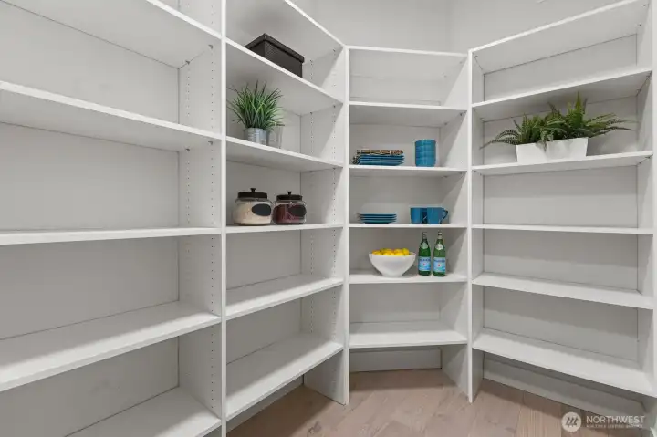 With abundant built-in shelving and exceptional storage, the walk-in pantry is designed to keep the kitchen as functional as it is beautiful.