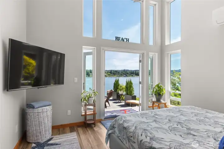 Primary bedroom with French doors to the patio. Primary bedroom with French doors to the patio.